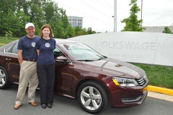 John and Helen Taylors next to a record-breaking VW Passat