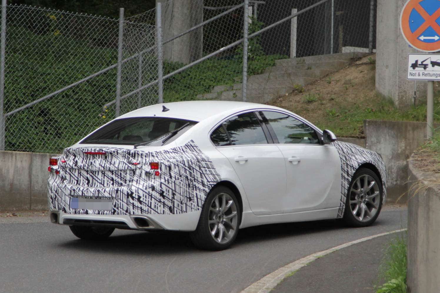 Facelifted Opel Insignia OPC test prototype side-rear view_no_copyright